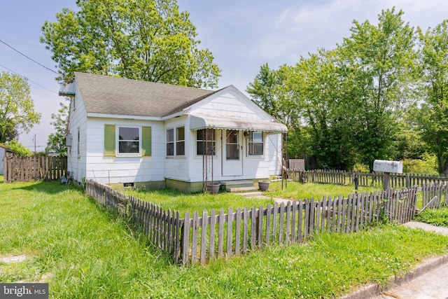 bungalow-style home with roof with shingles and crawl space