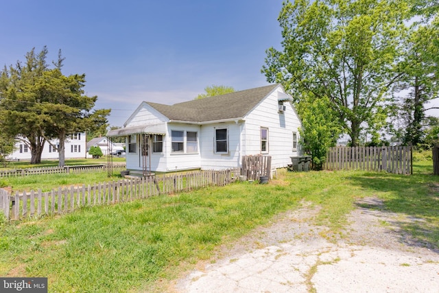 bungalow featuring roof with shingles