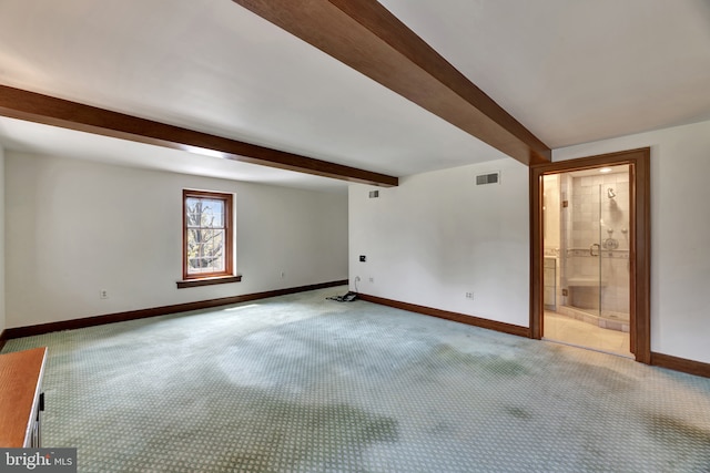 interior space featuring baseboards, visible vents, and beam ceiling