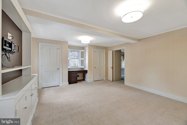 unfurnished bedroom with light carpet and baseboards
