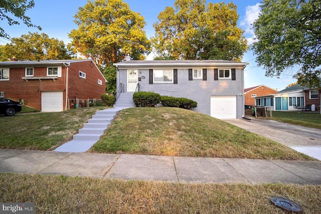 4112 Norcross St, Temple Hills, MD 20748 - view of front of house featuring concrete driveway, a front lawn, brick siding, and a garage