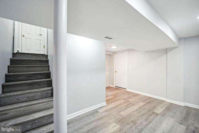 4112 Norcross St, Temple Hills, MD 20748 - stairs featuring visible vents, wood finished floors, and baseboards