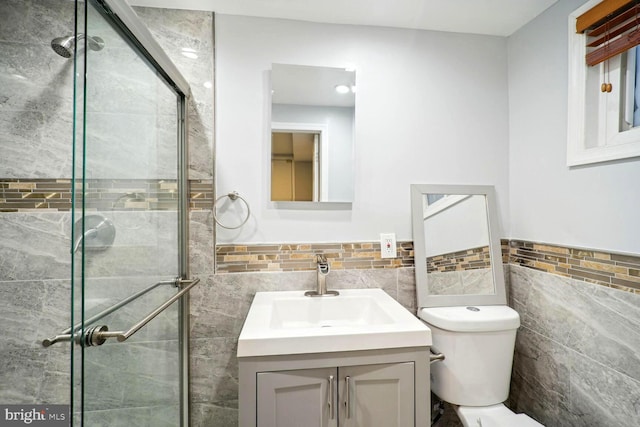 4112 Norcross St, Temple Hills, MD 20748 - full bath featuring a stall shower, tile walls, toilet, vanity, and a wainscoted wall