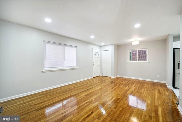 4112 Norcross St, Temple Hills, MD 20748 - unfurnished living room with wood finished floors, baseboards, and recessed lighting