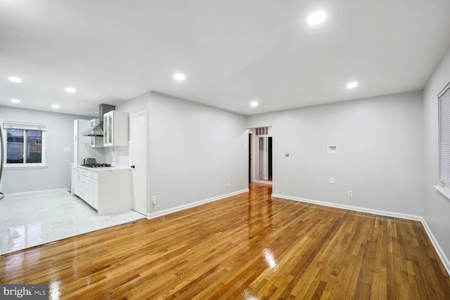 4112 Norcross St, Temple Hills, MD 20748 - unfurnished living room with baseboards, visible vents, light wood-type flooring, and recessed lighting
