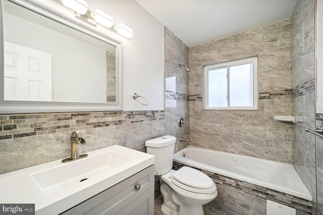 4112 Norcross St, Temple Hills, MD 20748 - full bathroom with vanity, tile walls, tiled shower / bath combo, and toilet
