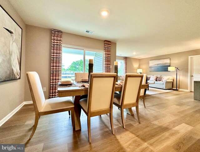 22187 Shorebird Way, Millsboro, DE 19966 - dining space with recessed lighting, baseboards, visible vents, and wood finished floors
