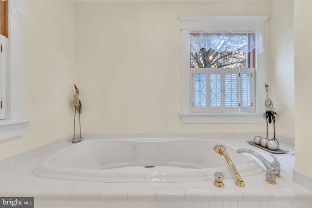 full bath with a bath and a wealth of natural light