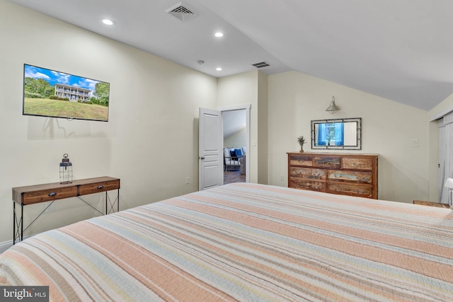 bedroom featuring lofted ceiling, recessed lighting, and visible vents