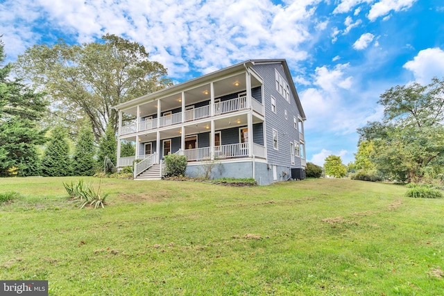 rear view of property with central AC, a yard, a porch, and a balcony