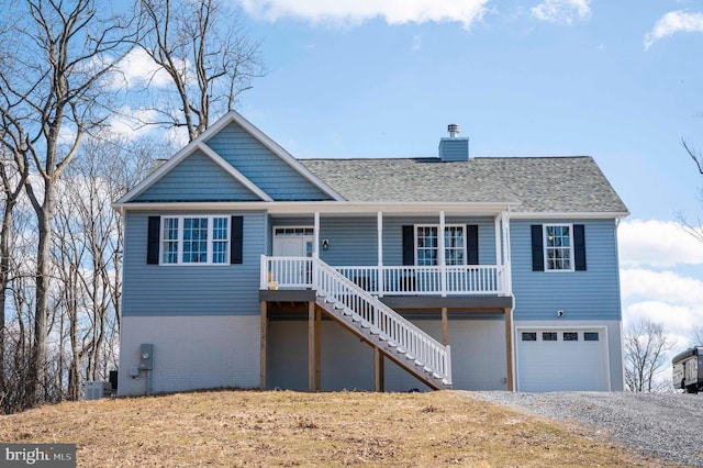 view of front of property with a chimney, brick siding, covered porch, central air condition unit, and stairway