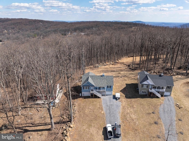 aerial view with a wooded view