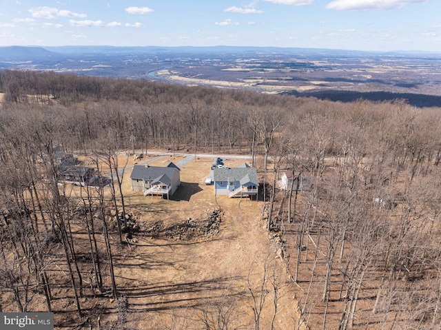 birds eye view of property with a rural view