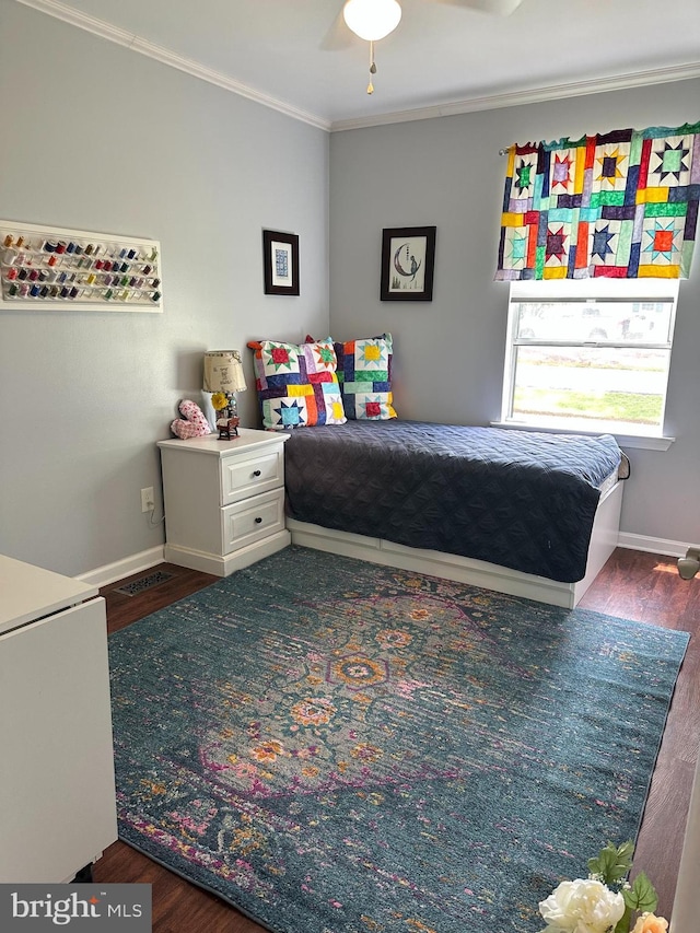 8186 Ebbtide Ln, Lusby, MD 20657 - bedroom featuring crown molding, wood finished floors, and baseboards
