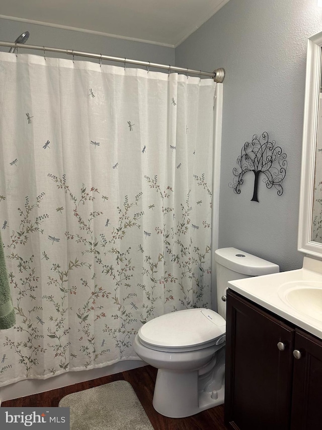 8186 Ebbtide Ln, Lusby, MD 20657 - bathroom with toilet, vanity, and wood finished floors
