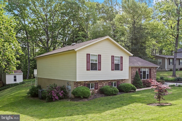 8186 Ebbtide Ln, Lusby, MD 20657 - view of front of property with a front lawn, brick siding, and central AC unit