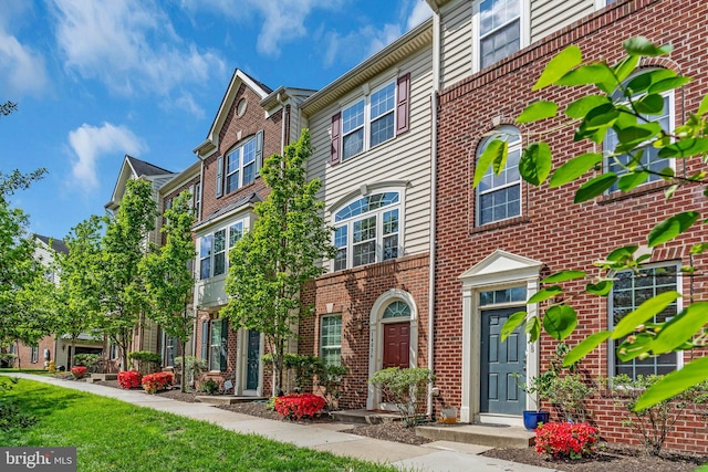 view of front of property featuring brick siding