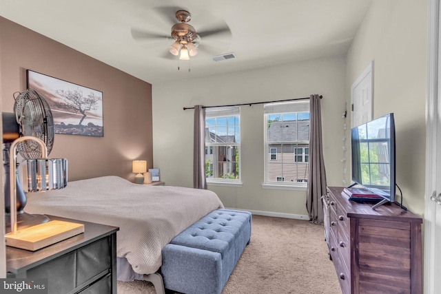 bedroom featuring baseboards, ceiling fan, visible vents, and carpet