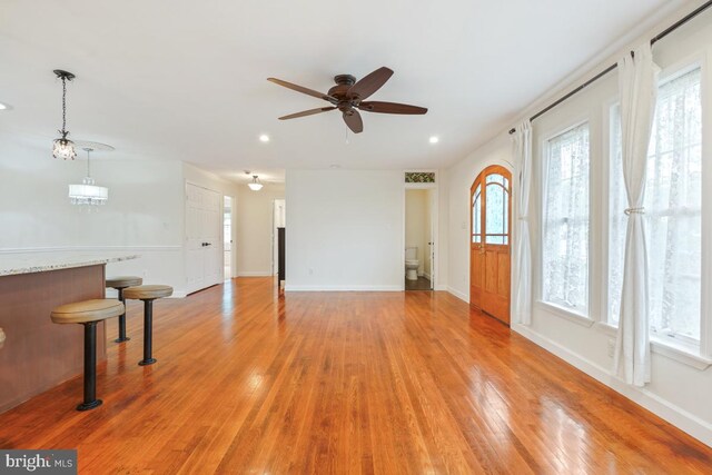 905 Burke Dr, Woodbridge, VA 22191 - unfurnished living room with a ceiling fan, light wood-style floors, baseboards, and recessed lighting
