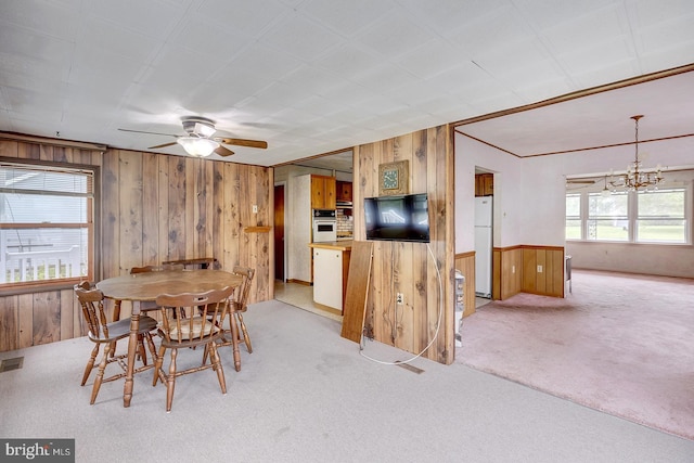 48 Tiffany Dr, Rehoboth Beach, DE 19971 - dining area featuring wooden walls, carpet, a chandelier, and ceiling fan