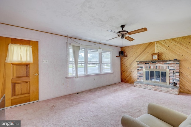 48 Tiffany Dr, Rehoboth Beach, DE 19971 - carpeted living area featuring a ceiling fan, wood walls, and a brick fireplace