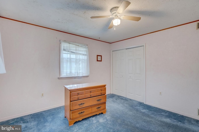 48 Tiffany Dr, Rehoboth Beach, DE 19971 - carpeted bedroom featuring ornamental molding, a closet, a textured ceiling, ceiling fan, and baseboards