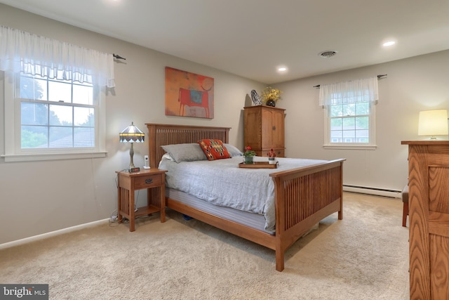 bedroom with baseboard heating, carpet flooring, recessed lighting, and baseboards