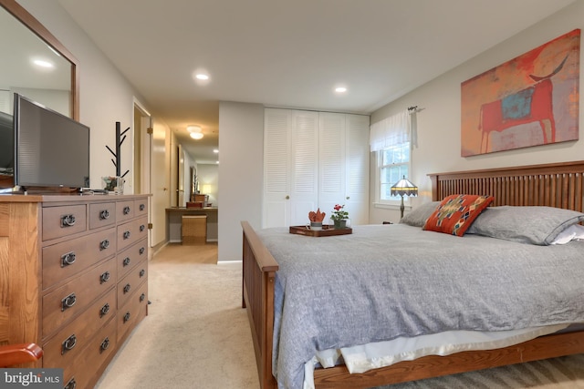 bedroom featuring light colored carpet, recessed lighting, a closet, and baseboards