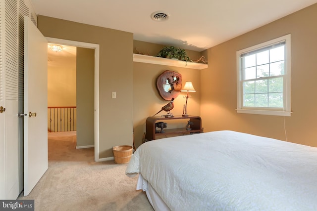 bedroom with carpet and baseboards