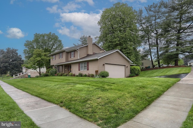 view of front of house with a chimney, a front lawn, and a garage