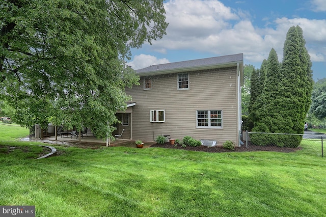 back of house featuring a patio area