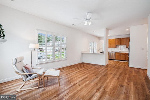 701 Ballast Way, Annapolis, MD 21401 - living area with light wood-style flooring, plenty of natural light, ceiling fan, baseboards, and recessed lighting