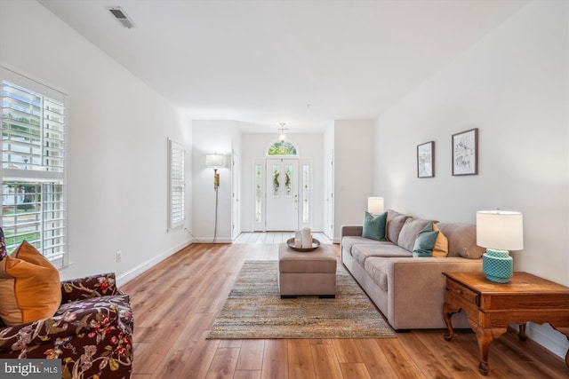 701 Ballast Way, Annapolis, MD 21401 - living area featuring healthy amount of natural light, light wood-style floors, and baseboards