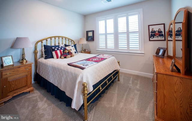 bedroom with visible vents, baseboards, and carpet floors