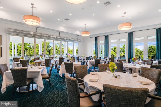 dining space with a wealth of natural light, visible vents, and recessed lighting