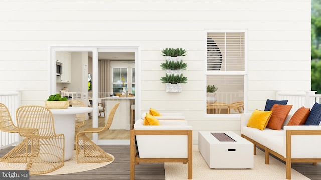 interior space with an outdoor living space with a fire pit