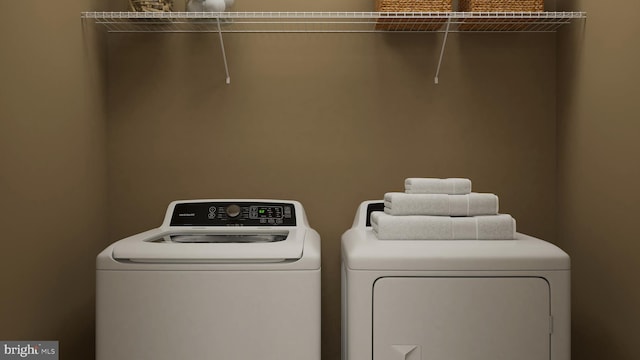 laundry area with laundry area and separate washer and dryer