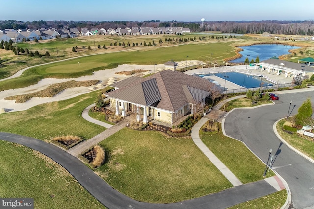 aerial view with a water view, golf course view, and a residential view