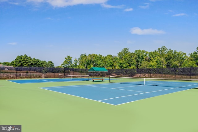 view of sport court featuring fence and community basketball court