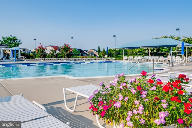 pool featuring a patio and fence