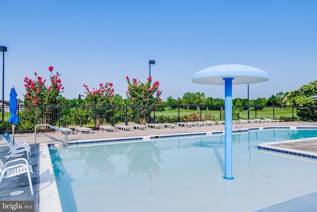community pool featuring fence