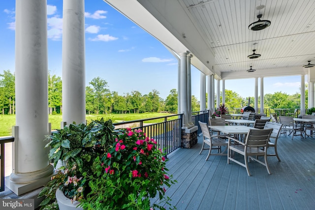 wooden deck with outdoor dining area