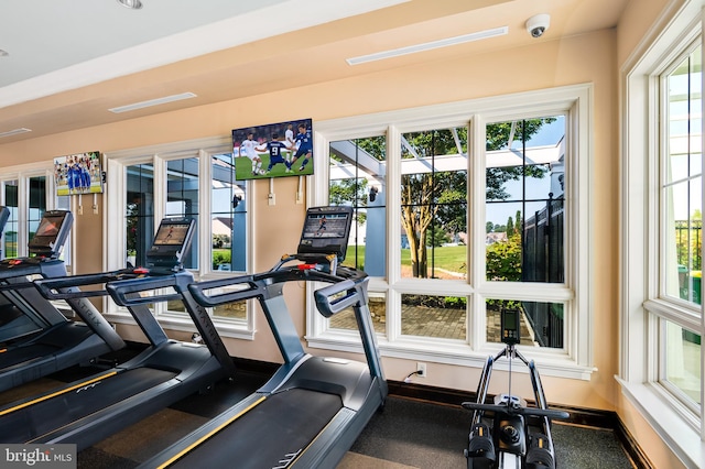 exercise room with baseboards