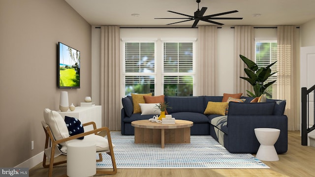 living room with ceiling fan and wood finished floors