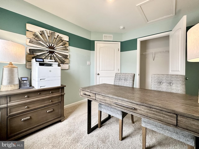 carpeted office with attic access, baseboards, and visible vents