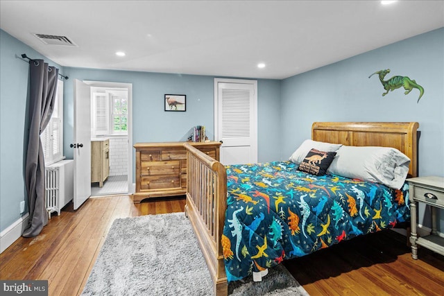4285 Applebutter Rd, Perkasie, PA 18944 - bedroom with wood finished floors, recessed lighting, radiator, baseboards, and a closet