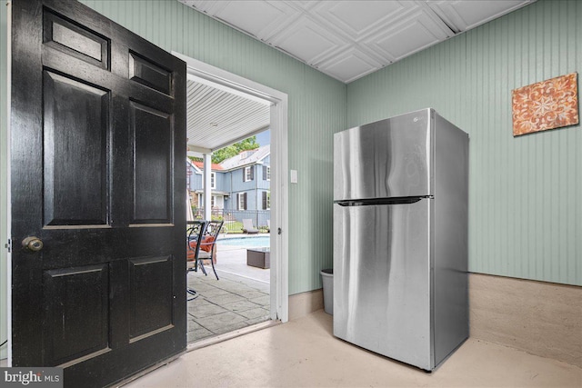 4285 Applebutter Rd, Perkasie, PA 18944 - kitchen with freestanding refrigerator, concrete flooring, and dark cabinetry