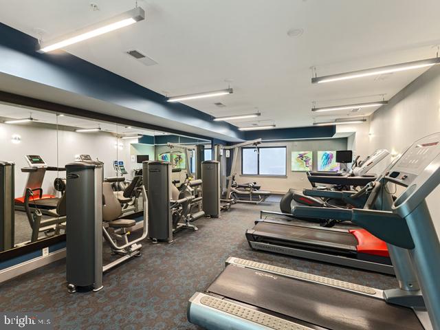 gym featuring visible vents and carpet floors