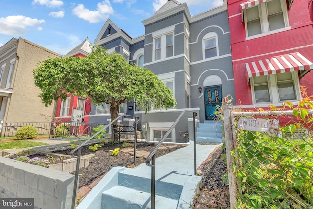 multi unit property featuring fence and brick siding