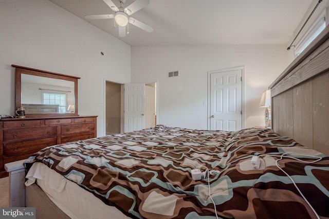 bedroom with high vaulted ceiling, a closet, a ceiling fan, and visible vents